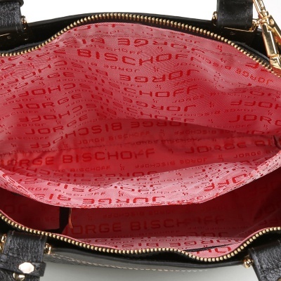 Interior de mala preta com fecho dourado e forro rosa com texto 'JORGE BISCHOFF' repetido