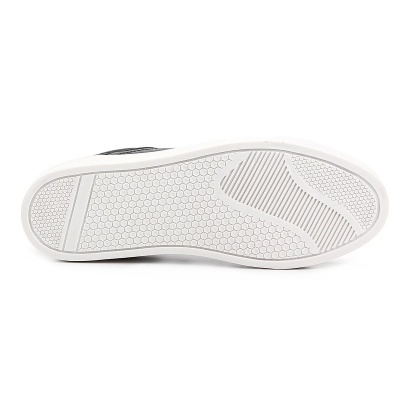 Sola de sapato desportivo branca com padrão hexagonal e riscas