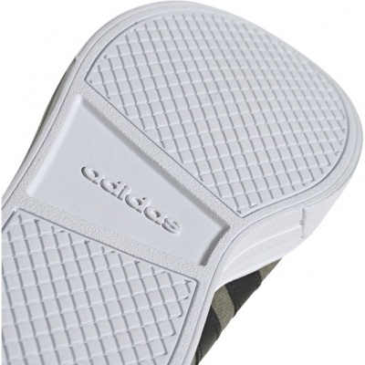 Sola branca de ténis Adidas com padrão em quadrícula