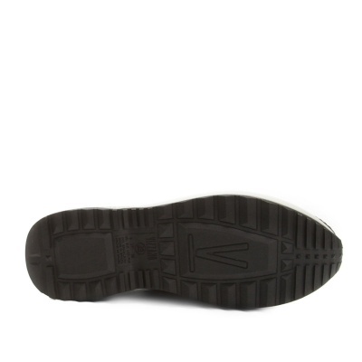 Sola preta de sapato com textura e inscrições sobre fundo branco