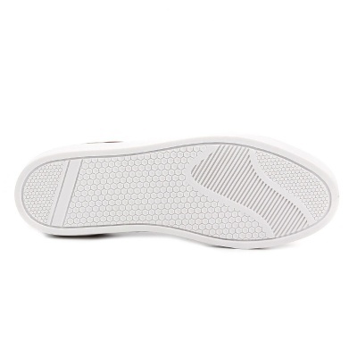 Sola de sapato branca com padrão de hexágonos e riscas