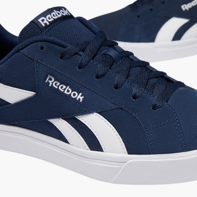 Ténis desportivos Reebok azul escuro com riscas brancas e sola branca