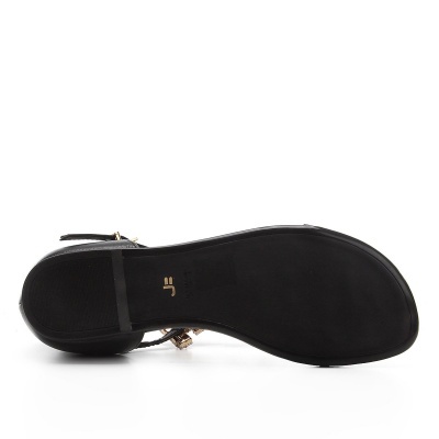 Sola de sandália preta com detalhes dourados