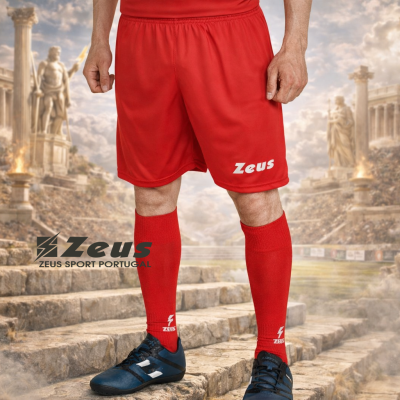 Jogador com calções e meias vermelhas Zeus em cenário de ruínas antigas