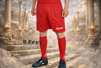 Jogador com calções e meias vermelhas Zeus em cenário de ruínas antigas